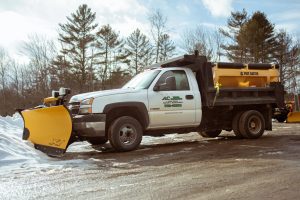 photo of the ac yard services plow truck in action